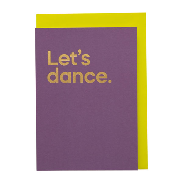 A purple card with 'Let's dance' printed in bold gold text, with a yellow envelope
