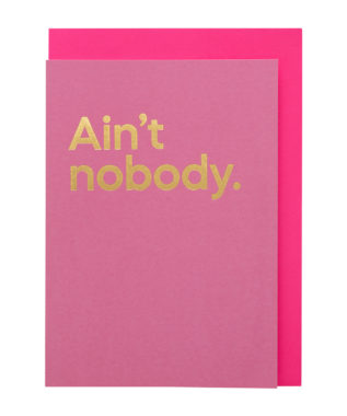 A pink card with 'Ain't nobody' printed in bold gold text, with a pink envelope