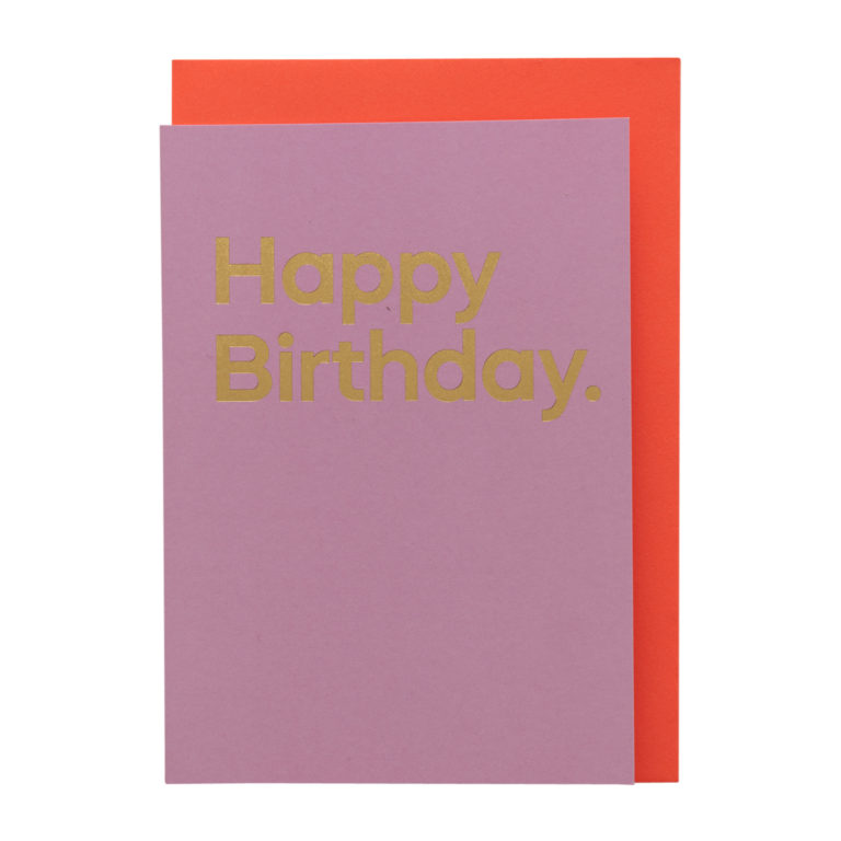 A pink card with 'Happy Birthday' printed in bold gold text, with an orange envelope